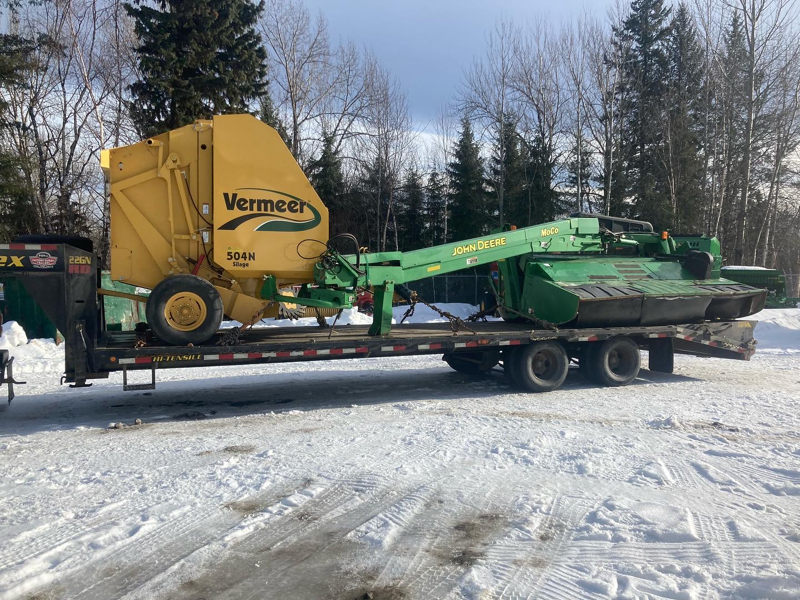 Farm equipment loaded on trailer